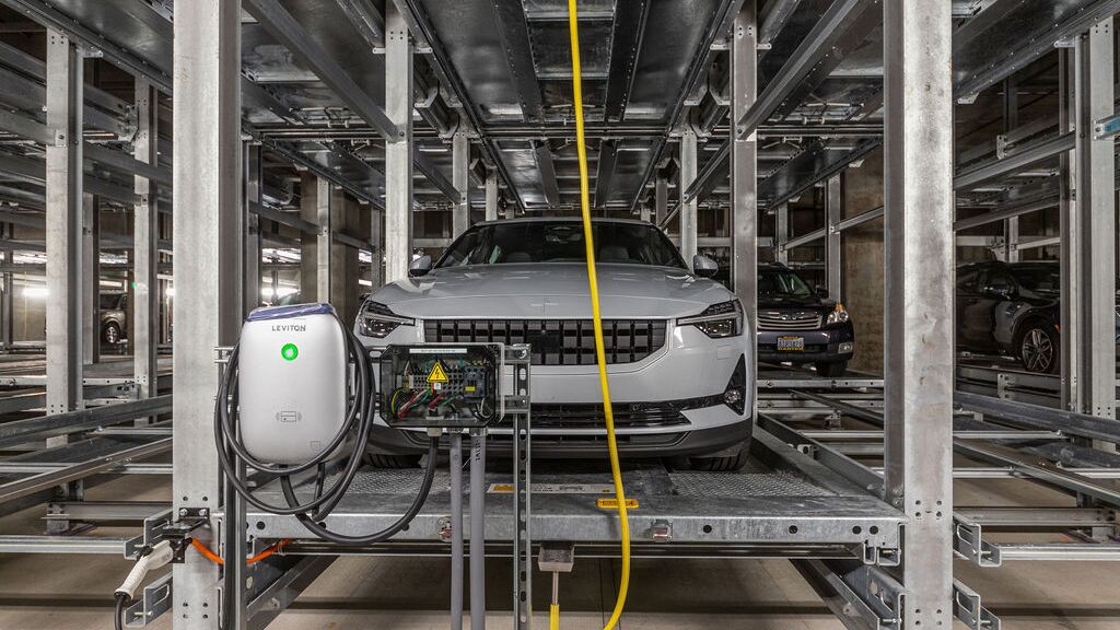 The car is being parked in an automated parking system.