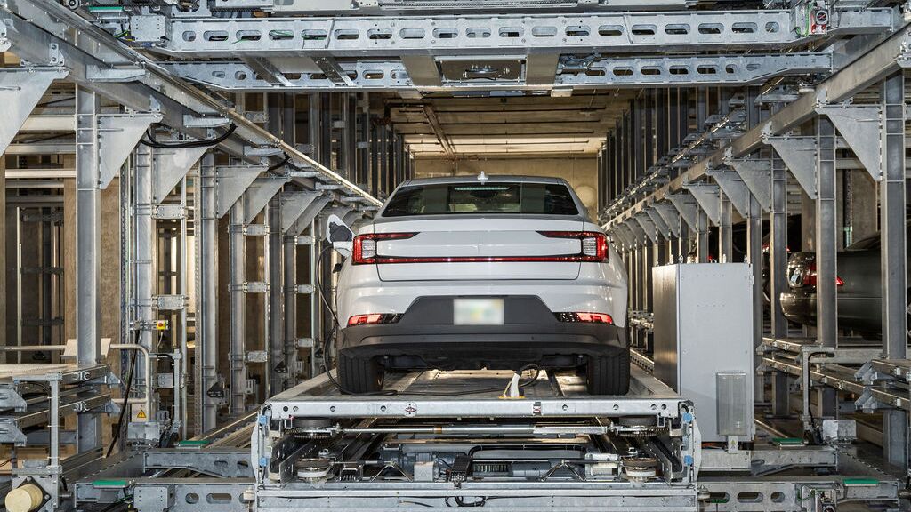 The car is parked on a parking platform within an automated parking system.