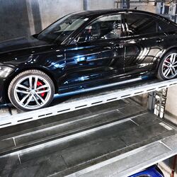 The car is parked in a car parking system