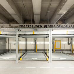 Front view of the parking system with sliding parking plates