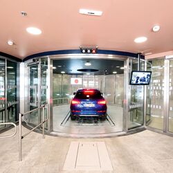 The car drives into a car parking system