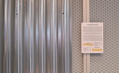 Corrugated steel decking hanging on a wall